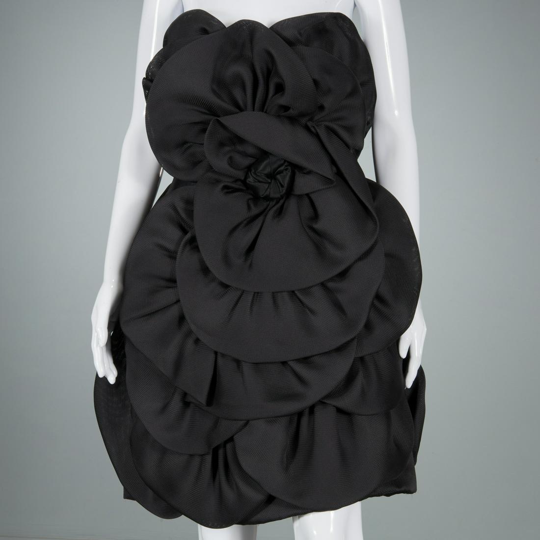 Paul-Louis Orrier black cocktail dress: Paul-Louis Orrier black cocktail dress, c. 1980s, Made in France, strapless sheath resembling petals of a flower surrounding the satin center, approx. 32"b, 33"l