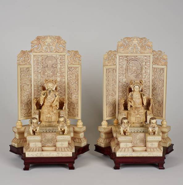 Pair Chinese ivory enthroned Imperial figures: Pair Chinese ivory enthroned Imperial figures, 20th c., Emperor and Empress on a screened platform, with hardwood stands, 17.25"h x 11.5"w x 8.25"d (excl. stands), 19.25"h (total)