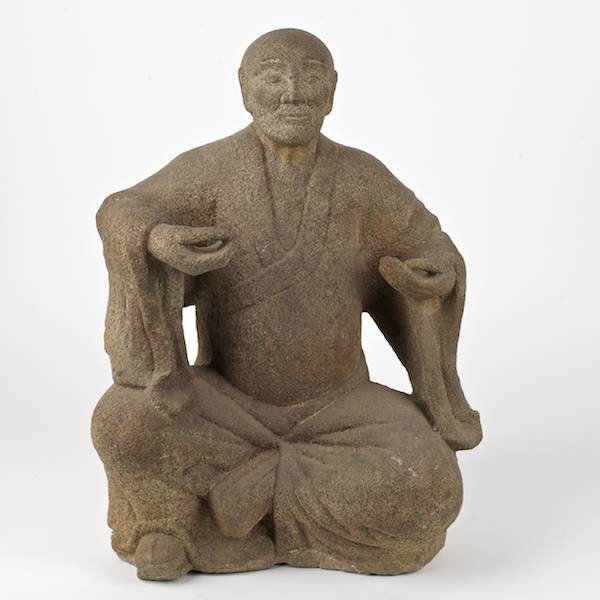 Antique Japanese carved granite seated figure: Antique Japanese carved granite seated figure, 19th c. or earlier, poss. a Samurai, on painted wood base, 19.5"h x 14.5"w (excl. base)