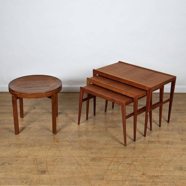 Danish Modern teak nesting tables and side table: Danish Modern teak nesting tables and side table, Mid 20th c., (4) pieces, 19.5"h x 27.75"l x 16.25"d (largest nesting table), 17.25"h x 21"dia. (side table)
