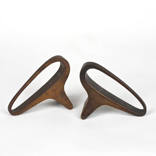Pair Modernist bronze bookends by Carl Aubock: Pair Modernist bronze bookends by Carl Aubock, Circa 1950s, signed "Aubock - Made in Austria", 4"h x 5"l x 2.25"d