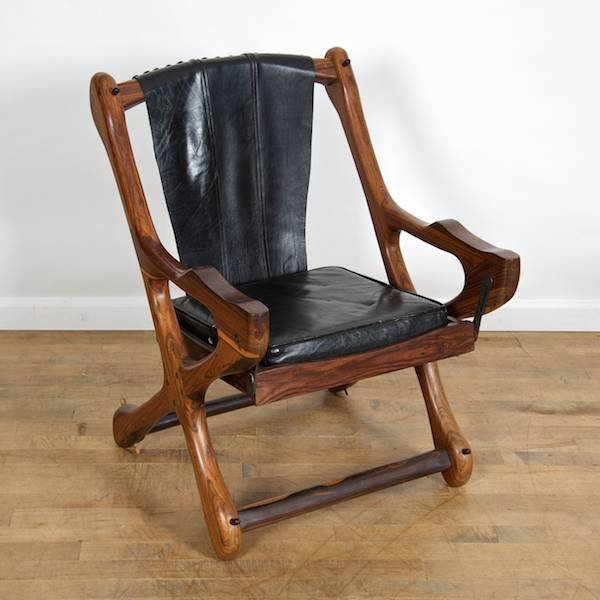Nice Brazilian rosewood and leather sling armchai: Nice Brazilian rosewood and leather sling armchair, Circa 1970, unmarked, 33"h x 23.5"w x 22"d