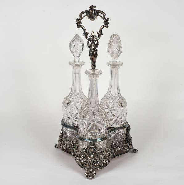 Large Victorian sterling silver cruet frame: Large Victorian sterling silver cruet frame, Sheffield, circa 1857, maker's marks of martin Hall & Co., with (3) cut glass bottles, 17.5"h x 7.5"w, approx. 55.4 ozt.