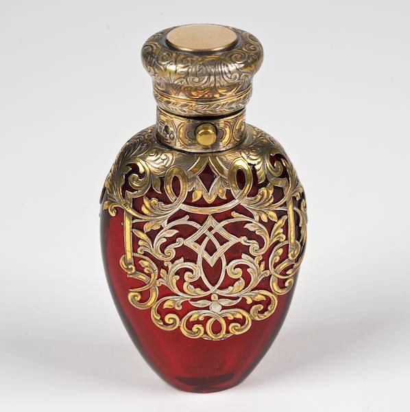 Victorian silver mounted ruby glass scent bottle: Victorian silver mounted ruby glass scent bottle, London, 19th c., maker's mark "WB", teardrop shaped, 3.75"l x 2"w