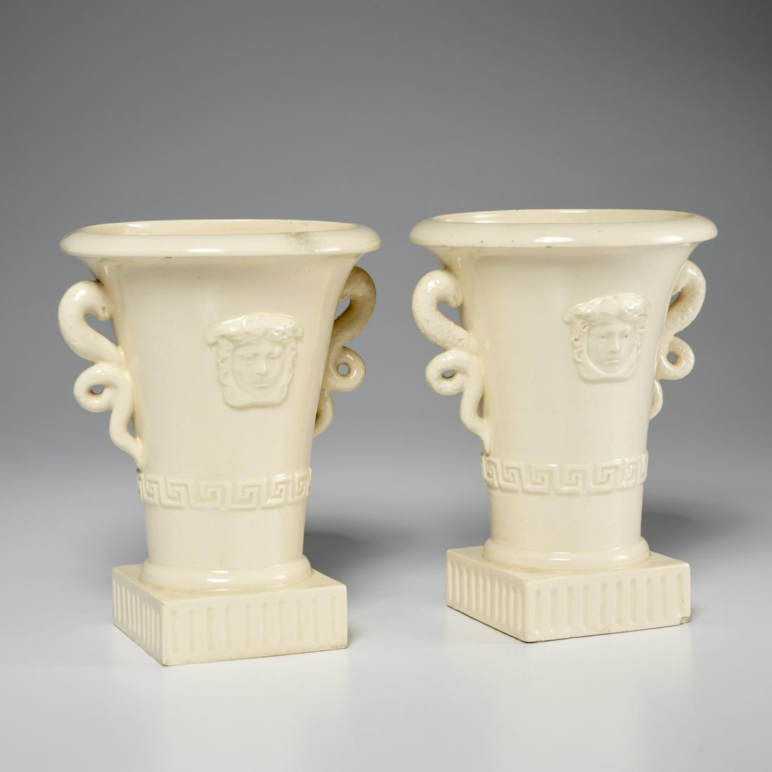 Pair San Marco (attrib) creamware Medusa urns: Pair San Marco (attrib) creamware Medusa urns, 19th/20th c., Continental, Medusa masks in relief, snake form handles, and Greek Key banding, unmarked, 8"h x 6"dia Provenance: A Private Collection: The