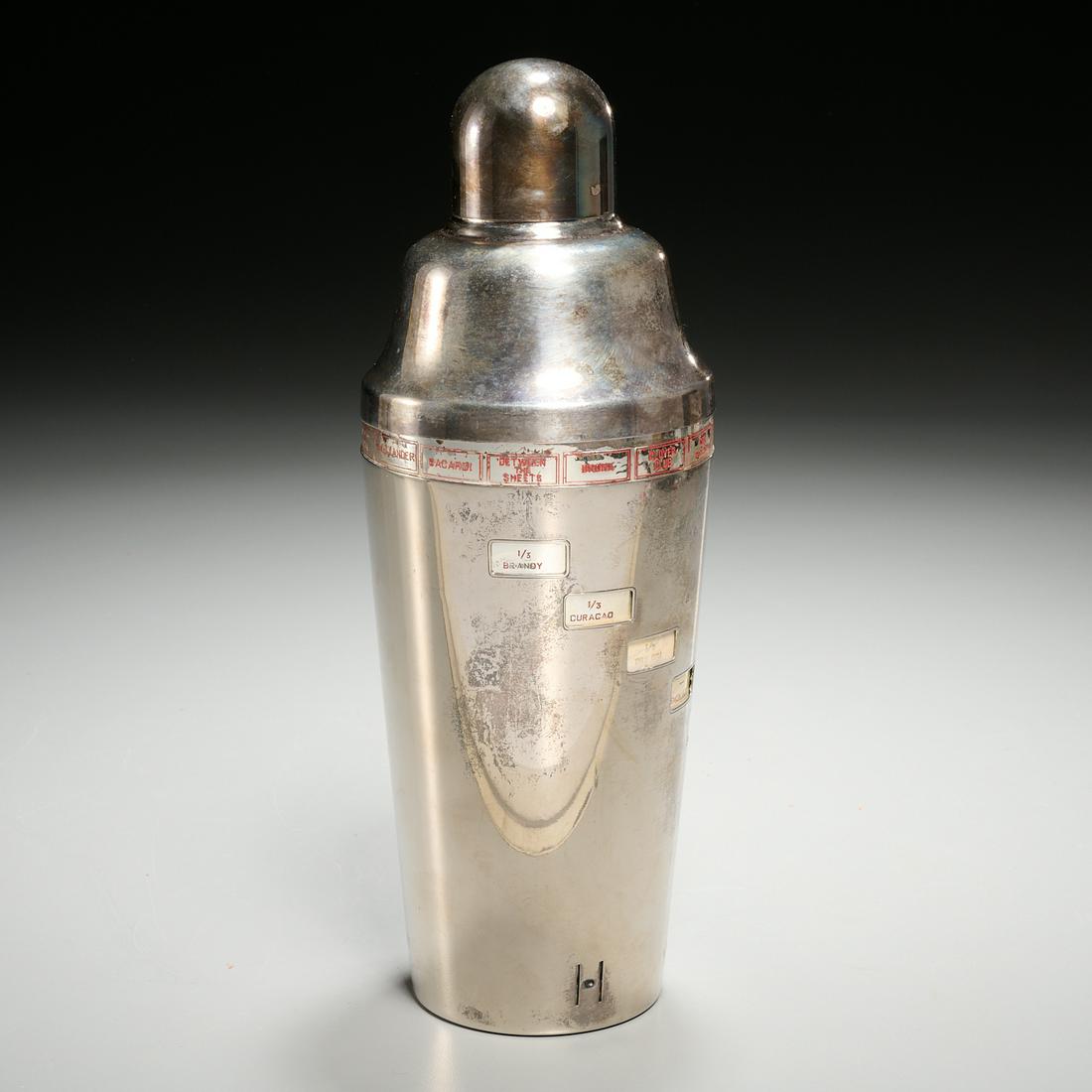 Napier Art Deco cocktail shaker: Napier Art Deco cocktail shaker, Mid 20th c., revolving drink recipe, stamped on underside, 11.25"h x 4.25"w Provenance: The Estate of Lilo De La Passardiere, 40 Central Park South, NYC