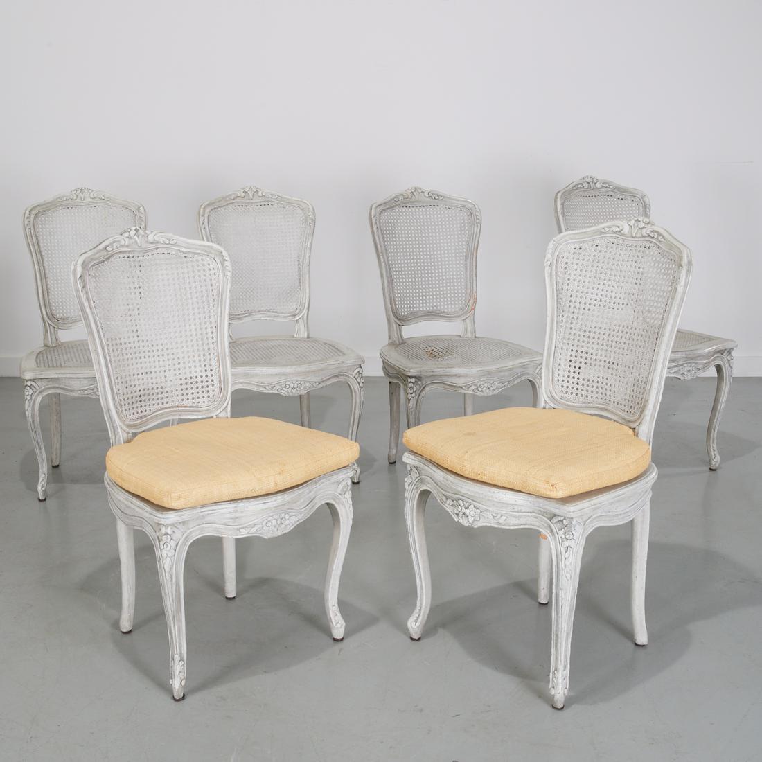 Set (6) Louis XV style caned dining chairs: Set (6) Louis XV style caned dining chairs, 20th c., (6) side dining chairs, distress painted in pale gray, with caned backs and seats, with floral crest to back rail, on cabriole legs, some with loos