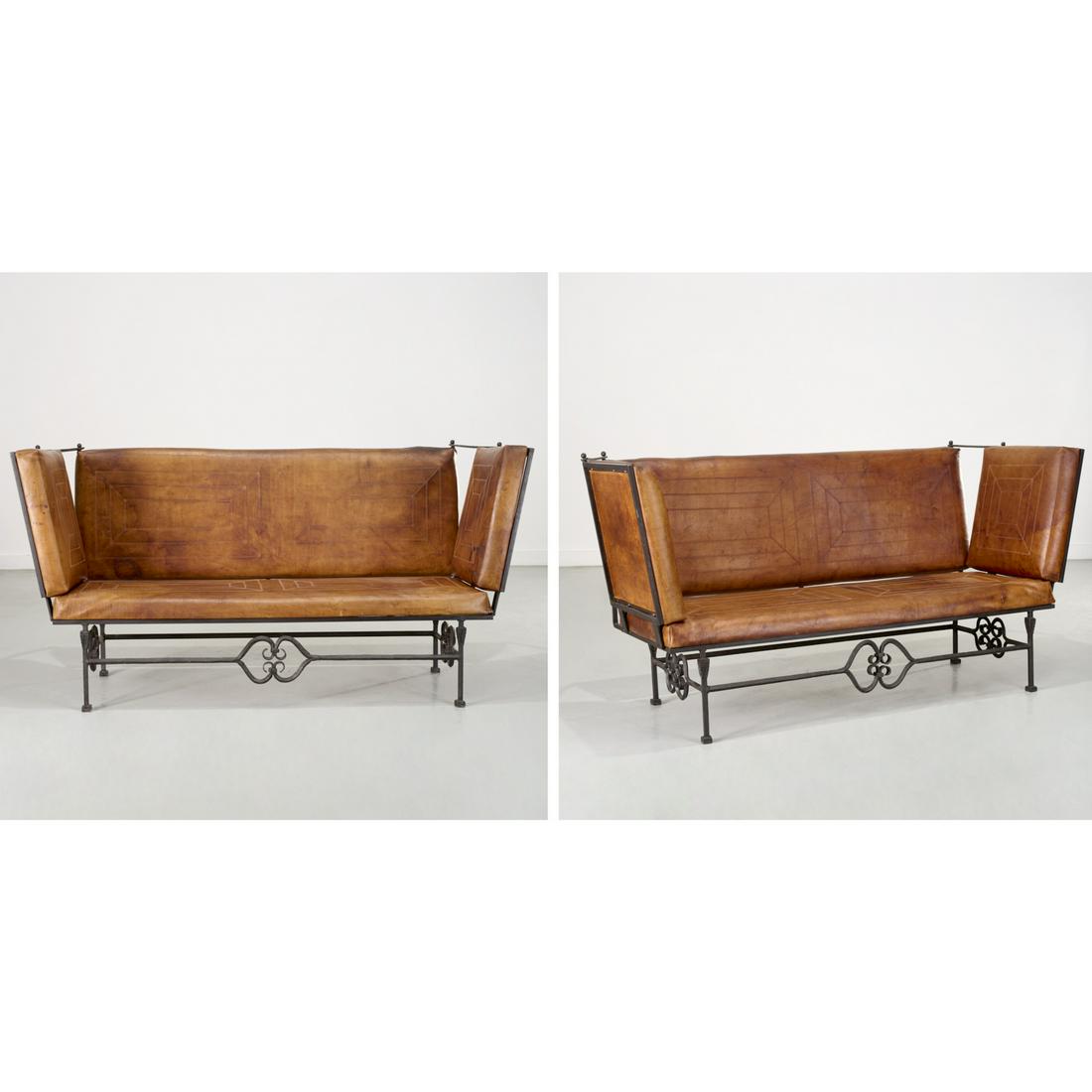 Pair Art Deco leather & wrought iron sofas: Pair Art Deco leather & wrought iron sofas, First half 20th c., Knole style settees upholstered in brown leather with decorative stitching, on an iron frame with decorative stretchers, opens to 35"h x