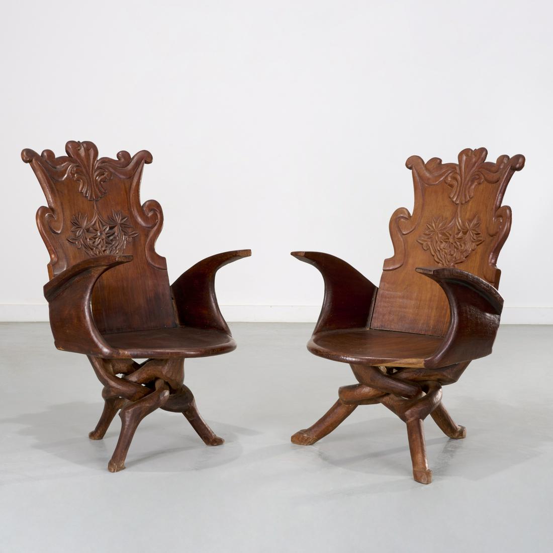 Pair unusual Art Nouveau style gondola chairs: Pair unusual Art Nouveau style gondola chairs, 20th c., possibly European Colonial, carved hardwood, the shield back carved with scroll crest rail and relief design in center, above plank seat with ro