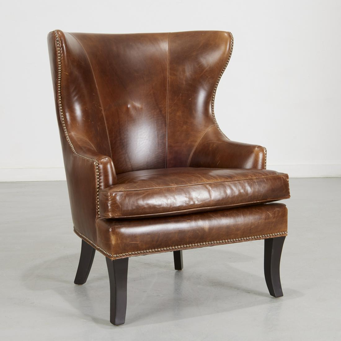 Ralph Lauren style leather wing chair: Ralph Lauren style leather wing chair, 21st c., handsome leather wing chair, with nail head trim, raised on slightly splayed legs, unmarked, 41.25"h x 31.5"w x 25.5"d, 21"h (to seat)