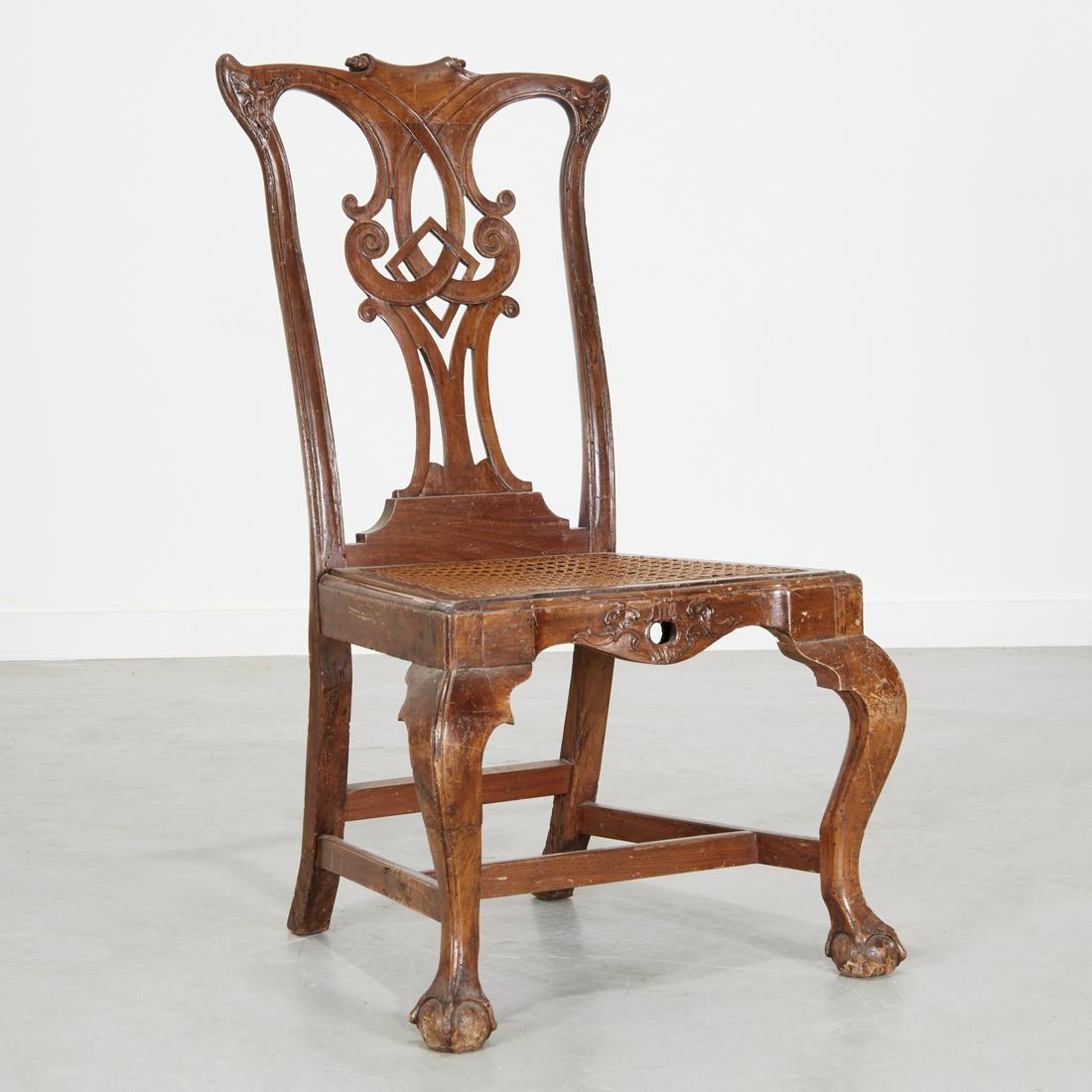 Portuguese Colonial carved hardwood side chair: Portuguese Colonial carved hardwood side chair, 18th c., the shaped and carved crest above an elaborately pierce carved splat, over trapezoidal seat with serpentine front, raised on cabriole legs on c