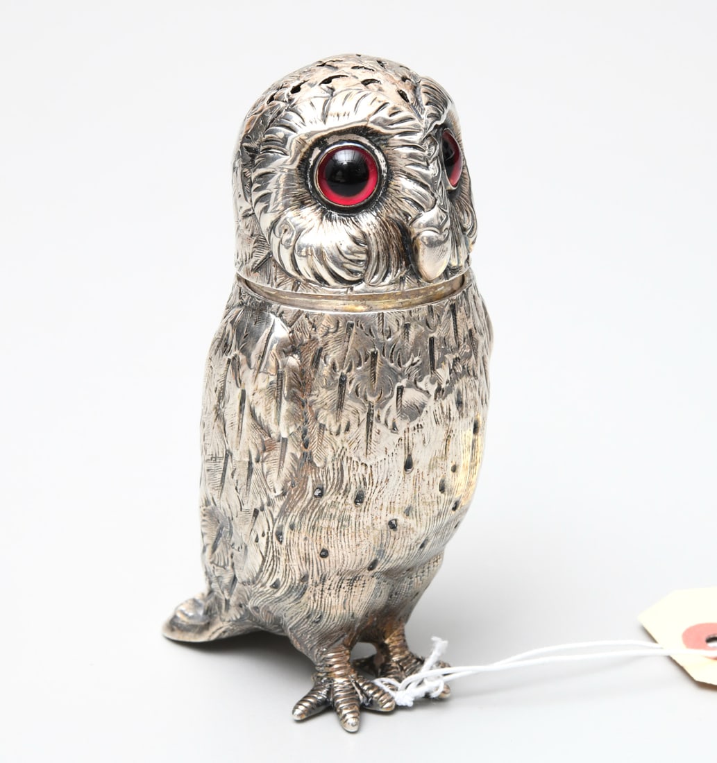 Victorian sterling shaker modeled as an owl: Victorian sterling shaker modeled as an owl, London, c. 1867, maker's mark for Edward Charles Brown, with glass eyes, pierced head and gilt interior, 4.25"h x 2"w x 2.5"d, approx. 3.4ozt