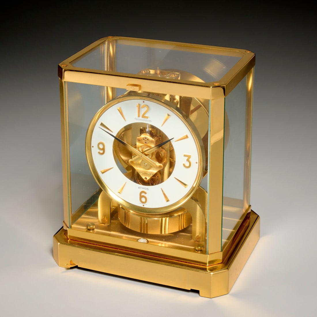 Jaeger Le Coultre Atmos clock: Jaeger Le Coultre Atmos clock, 20th c., Switzerland, in brass and glass case, signed on dial, stamped "374433", 9.25"h x 8.25"w x 6.5"d