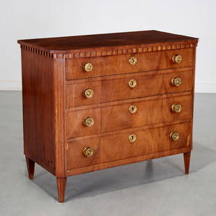 Continental Neo-Classical walnut commode: Continental Neo-Classical walnut commode, 19th c., four drawers with embossed brass drawer pulls and escutcheons, 32.5"h x 37.5"w x 19.5"d Provenance: A Private Collection: 885 Park Avenue, NYC