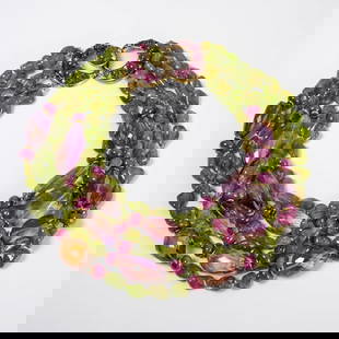 Iradj Moini gemstone necklace: Iradj Moini gemstone necklace, c. 1990s, comprised of six strands of beads consisting of various sized amethyst and Peridot stones, moon shaped double clasp with purple stones and rhinestones, signed