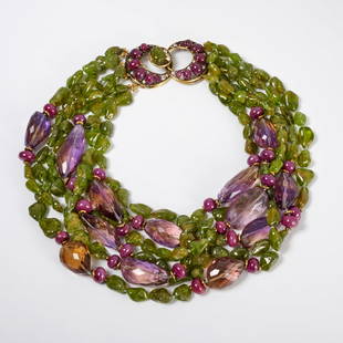 Iradj Moini gemstone necklace: Iradj Moini gemstone necklace, c. 1990s, comprised of six strands of beads consisting of various sized amethyst and Peridot stones, moon shaped double clasp with purple stones and rhinestones, signed