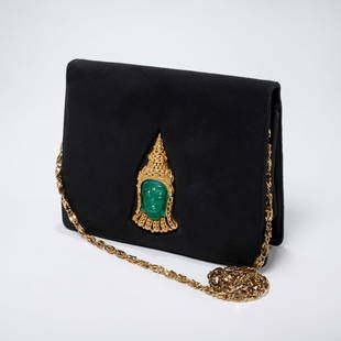 Martin Van Schaak carved buddha bag: Martin Van Schaak carved buddha bag, 20th c., Made in New York, black suede flap style with green carved applique framed in gold gilt metal, removable chain strap, stamped, approx. 6"h, 8"w Provenance