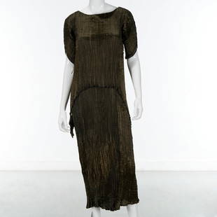 Mariano Fortuny green silk Peplos evening gown: Mariano Fortuny green silk Peplos evening gown, c. 1920-1930, Made in Italy, finely pleated dark pine silk with glass beads and silk cording seams, batwing sleeves, interior label, approx. 49"l Proven