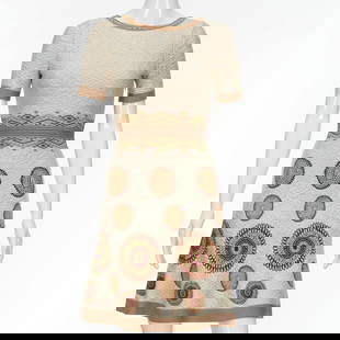 Azzedine Alaia Paris knit dress: Azzedine Alaia Paris knit dress, 2000s, Made in Italy, for Saks Fifth Avenue, textured ivory knit with medallion detail, original retail $3020, size 36, approx., 30"b, 35"l Provenance: A Private Colle