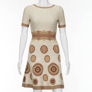 Azzedine Alaia Paris knit dress: Azzedine Alaia Paris knit dress, 2000s, Made in Italy, for Saks Fifth Avenue, textured ivory knit with medallion detail, original retail $3020, size 36, approx., 30"b, 35"l Provenance: A Private Colle