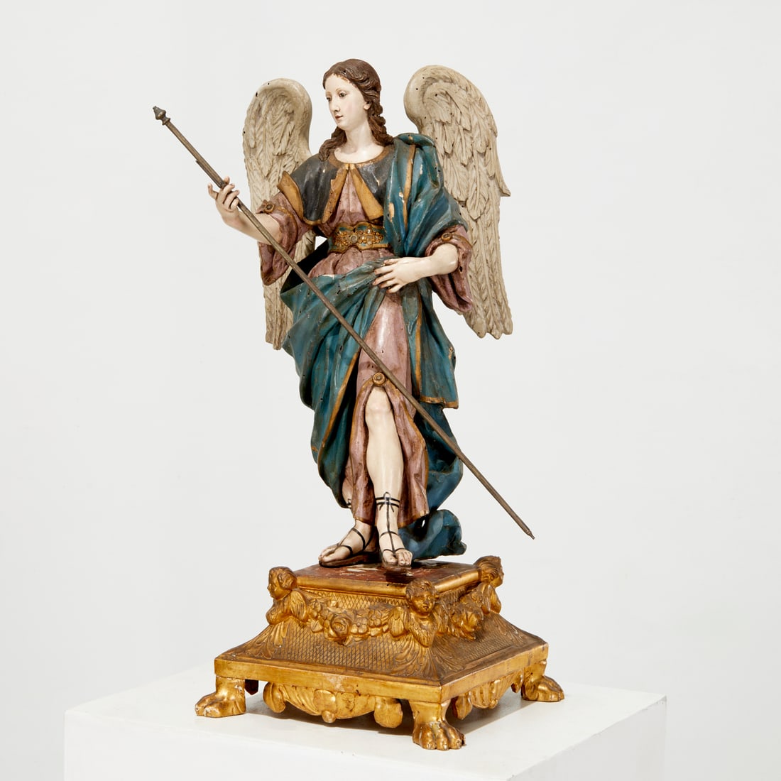 Large Italian model of the Archangel Raphael: Large Italian model of the Archangel Raphael, Late 18th c., Naples, in the manner of Giuseppe Gore, carved and polychrome painted wood with brass staff, faux jewels at belt, metal spike underneath for