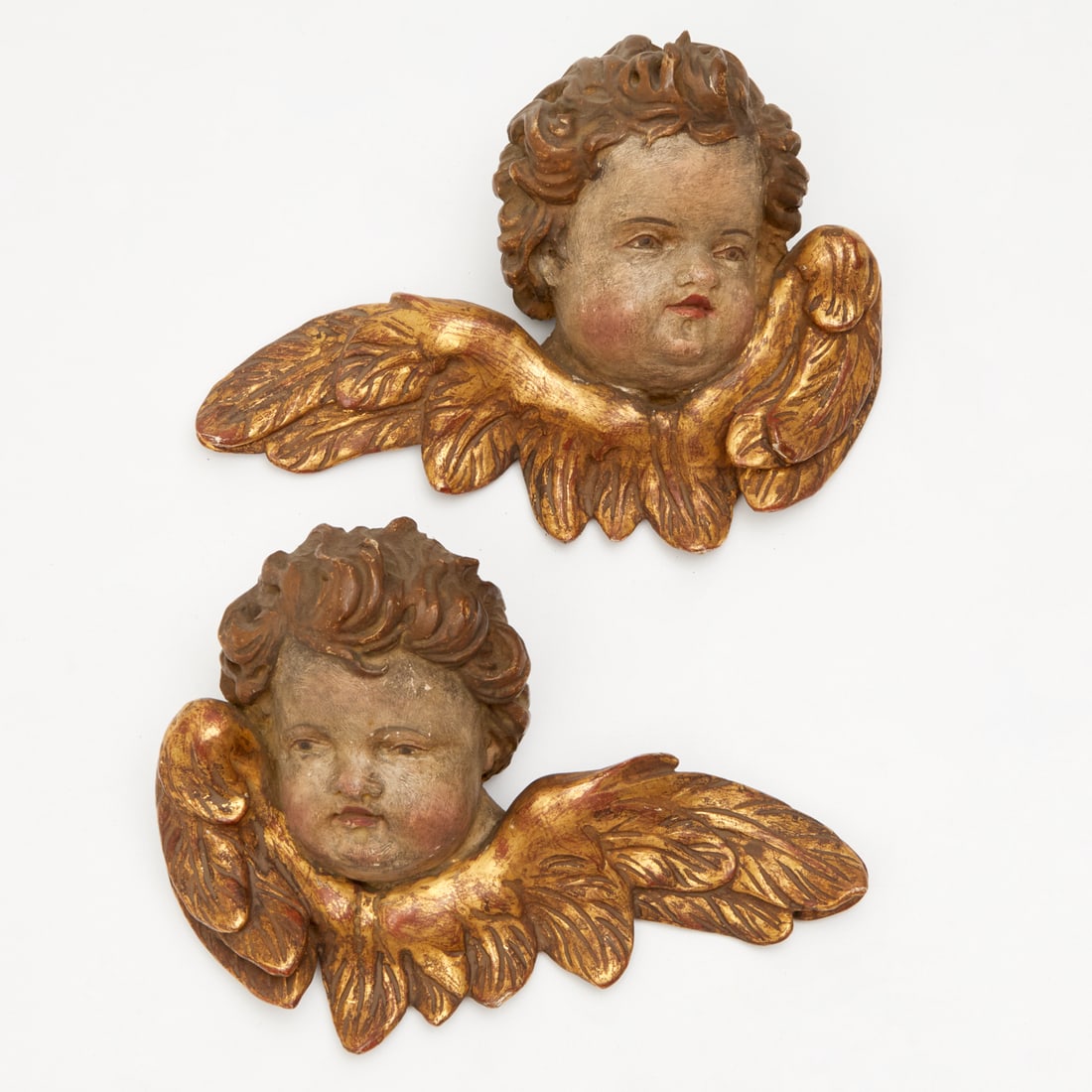 Pair Continental Baroque style giltwood Amorini: Pair Continental Baroque style giltwood Amorini, Late 19th c., Italy or Spain, polychrome painted and giltwood, 6"h x 9"w x 4"d Provenance: The Collection of Linn Howard Selby Notes/Literature: Linn H