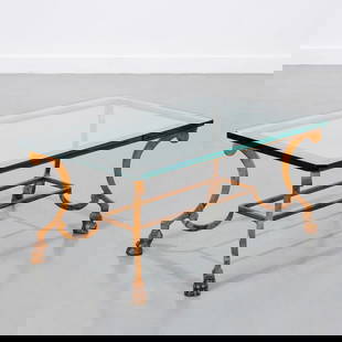 Maison Ramsay style coffee table: Maison Ramsay style coffee table, 20th c., half-inch glass tabletop, gilt metal base with paw feet, unsigned, 15"h x 34"l x 20"w Provenance: A Private Collection: 502 Park Avenue, NYC