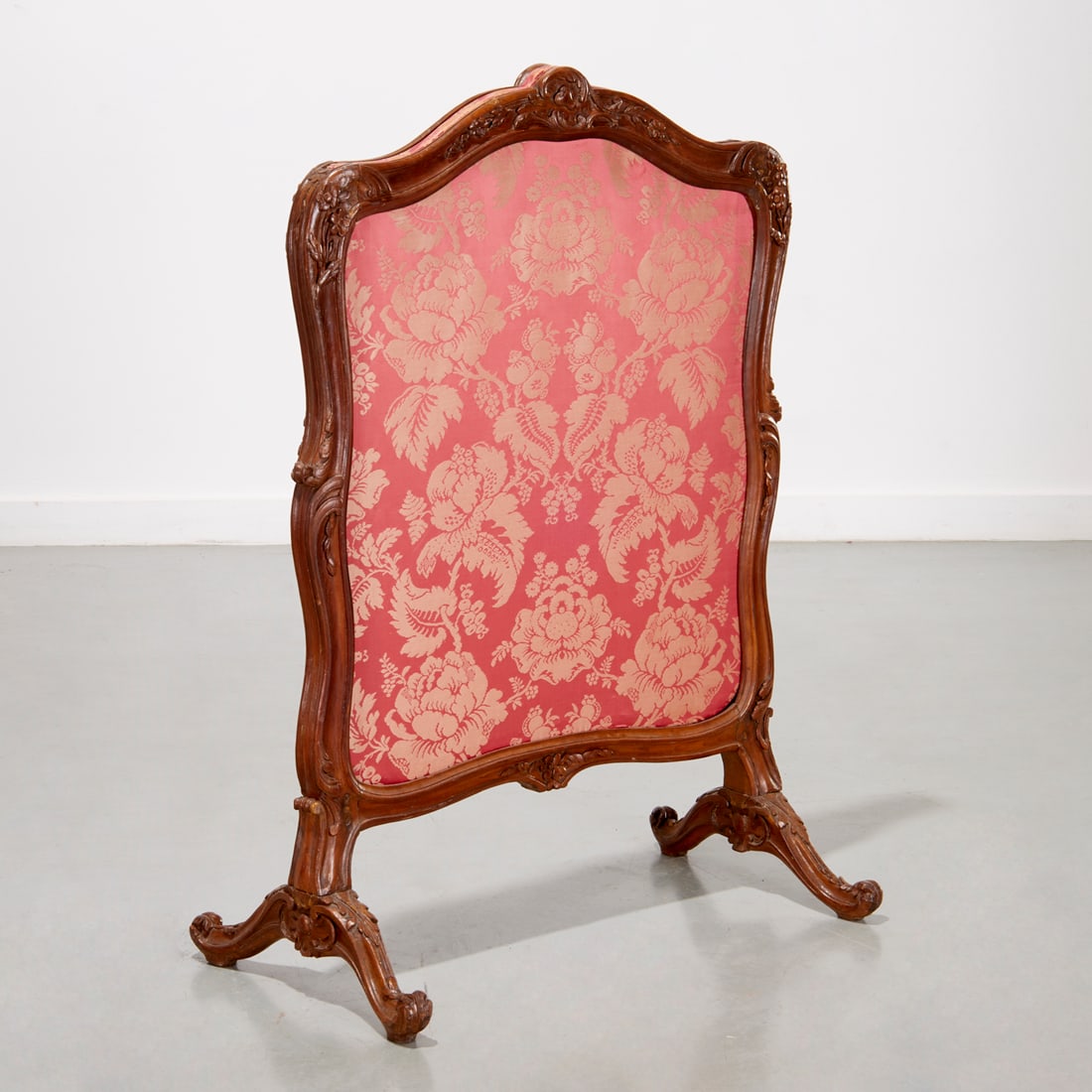 Louis XV carved beechwood screen: Louis XV carved beechwood screen, 18th/19th c., scrolled crest with trailing flowers, cranberry damask insert, 40.75"h x 29.5"w x 16.5"d