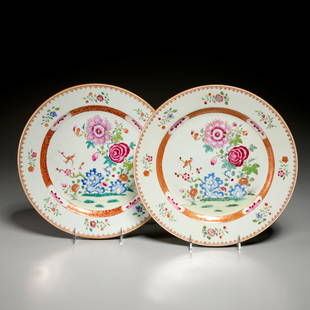 Pair Chinese famille rose chargers: Pair Chinese famille rose chargers, Qing Dynasty (c. 18th c.), gilt and polychrome enameled porcelain, decorated with flowering branches inside a gilt and iron red band, unmarked, 12"dia Provenance: A