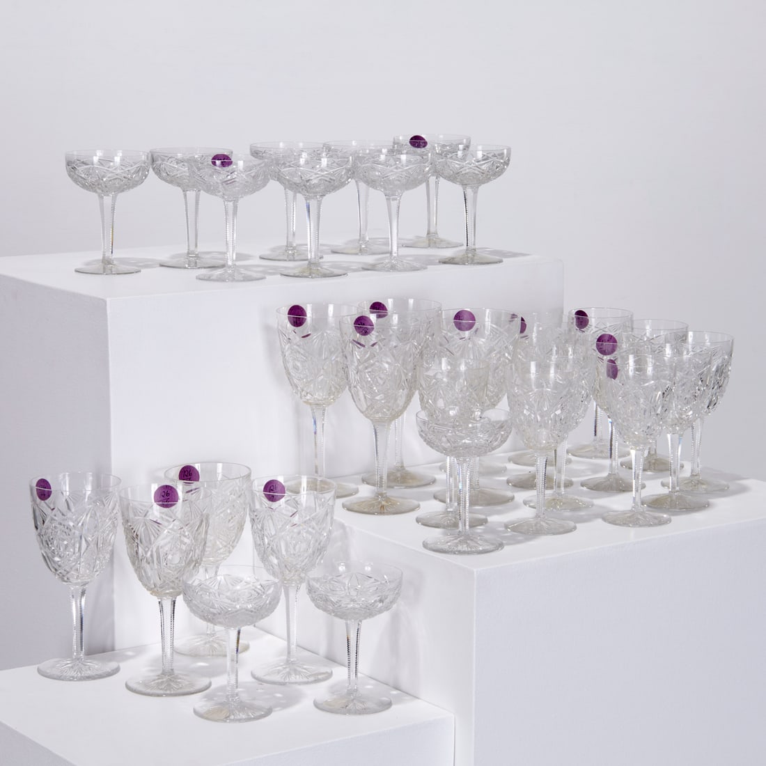 Baccarat "Lagny" stemware service, (32) pieces: Baccarat "Lagny" stemware service, (32) pieces, Introduced 1912, France, faceted cut crystal, including (8) water goblets, 7.75"h, (12) claret wine glasses, 6.5"h, and (12) champagne coupes, each with