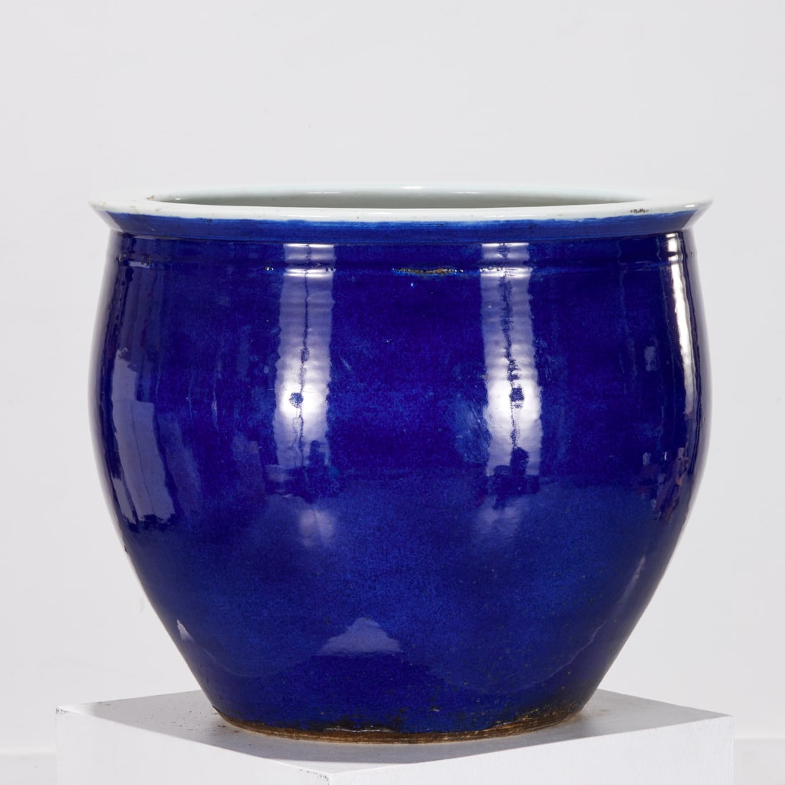 Chinese monochrome blue glazed jardiniere: Chinese monochrome blue glazed jardiniere, Qing Dynasty (Likely 19th c.), with white glazed rim and interior, unmarked, 15.5"h x 18.5"dia. Provenance: A Private Collection: 550 Park Avenue, NYC; Willi