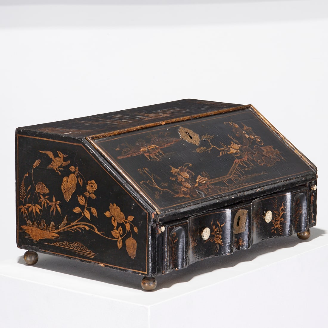 George III black japanned secretary: George III black japanned secretary, 18th/19th c., black lacquered and gilt, decorated in landscape scenes with pagodas, slant front opens to writing surface and interior fitted with drawers and cubbi