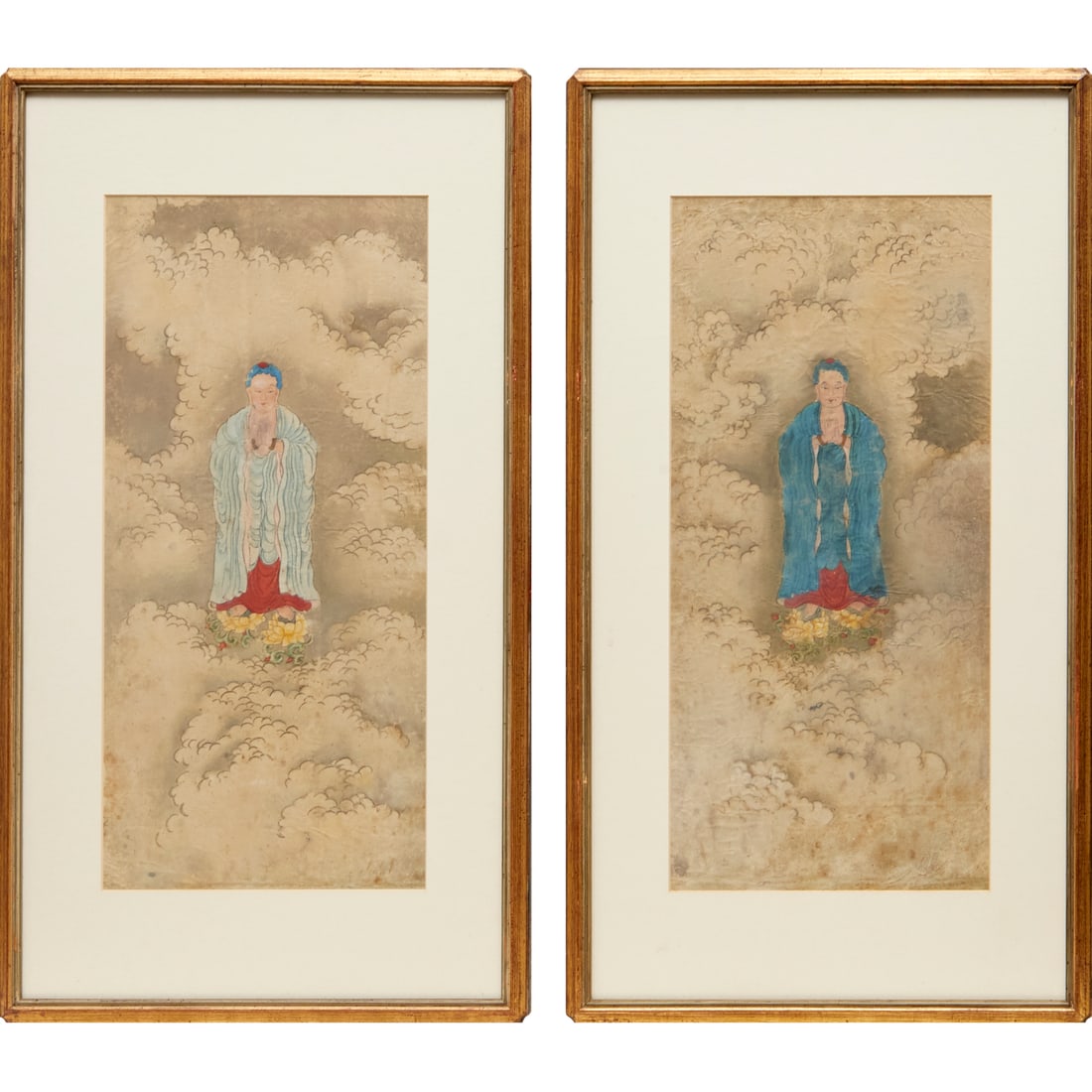 Pair antique Buddhist paintings: Pair antique Buddhist paintings, 18th c. or earlier, China, watercolor on paper, each depicts the Amitabha Buddha standing on lotus blossoms amidst clouds, one in namaskara mudra, the other possibly d