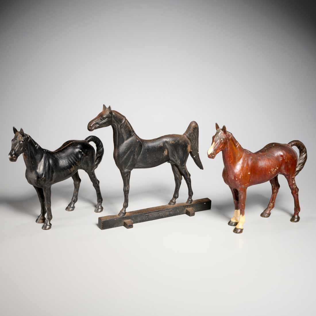 (3) Vintage cast iron equine doorstops: (3) Vintage cast iron equine doorstops, First half 20th c., incl. two patinated models, possibly Hubley, and a "KIng's Genius" doorstop by the Rife-Loth Corp., Waynesboro, VA, 12"h x 12"l x 3.25"w Pro