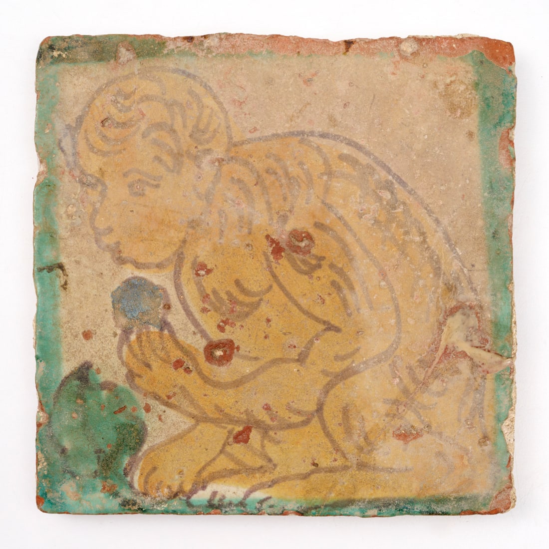 Continental glazed majolica monkey tile: Continental glazed majolica monkey tile, 17th/18th c., possibly earlier, white, yellow and green glaze, 7"squ