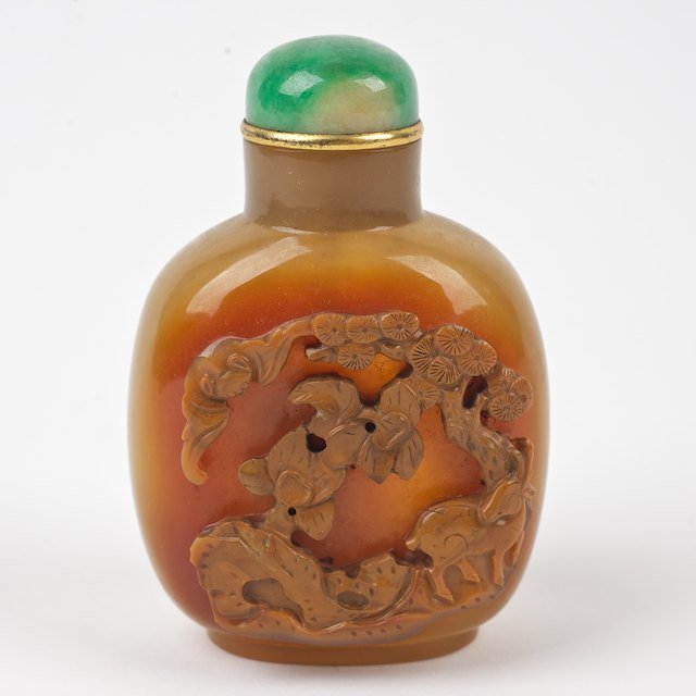 Nice Chinese carved agate snuff bottle: Nice Chinese carved agate snuff bottle: Qing Dynasty, flora and fauna, green/white jade cap, 3.25"h x 2.25"w - Condition Report: overall good, no significant damage or repairs observed - Provenance: D