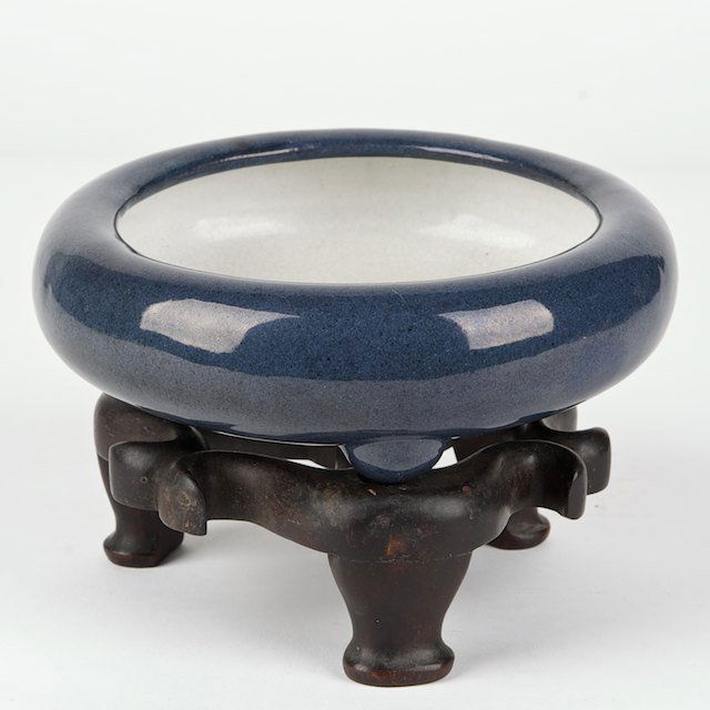 Chinese glazed earthenware brush washer: Chinese glazed earthenware brush washer: Qing Dynasty, impressed seal mark partially obscured by glaze, hardwood stand, 2.25"h x 6.5"dia. (excl. stand)- Condition Report: overall good/fair, glaze flak