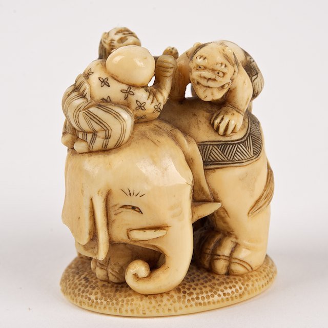 Nice quality artist signed carved ivory netsuke: Nice quality artist signed carved ivory netsuke: Meiji Period, Oni on the back of an elephant, 1.5"h x 1.25"w - Condition Report: overall good/fair, surface wear commensurate with age and handling, ag