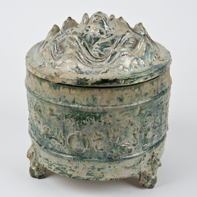 Chinese archaic iridescent glazed pottery contain: Chinese archaic iridescent glazed pottery container: Poss. Han Dynasty, 9.5"h x 7.5" dia. - Condition Report: overall good/fair, chips, crazing, mineral deposits, glaze scratches - Provenance: H.M. Lu