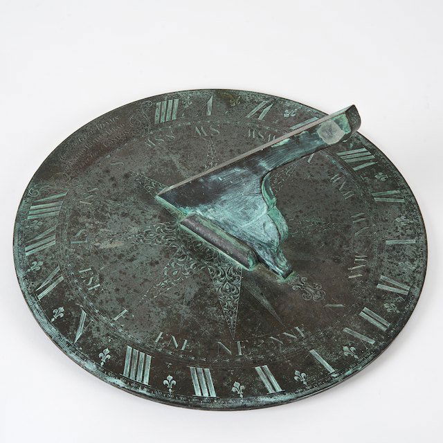 Important George III brass sundial by George Adam: Important George III brass sundial by George Adams: 18th c., engraved "Made by GEO. ADAMS at TYCHO BRAHE HEAD in... LONDON", 10.5"h x 16"dia. - Condition Report: overall good/fair, natural verdigris p