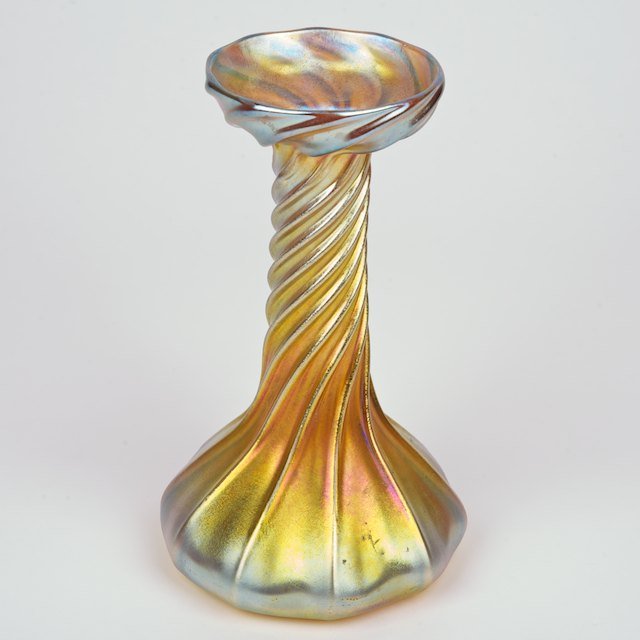 Tiffany Studios gold Favrile glass lamp base: Tiffany Studios gold Favrile glass lamp base: First quarter 20th c., signed "L.C.T. Favrile", no. 4432, 7"h x 4.25"dia. - Condition Report: overall good/fair, drilled for lamp cord, a few light surfac