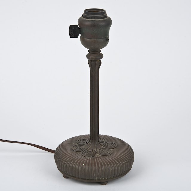 Tiffany Studios bronze lamp base no. 25866: Tiffany Studios bronze lamp base no. 25866 : 20th c., 10.25"h x 5" dia. - Condition Report: overall fair, prongs removed, patina rubbed