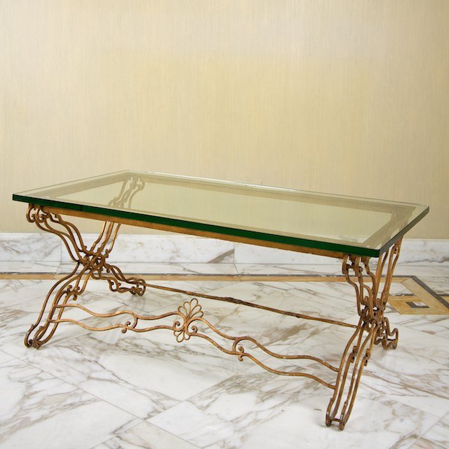 Gilbert Poillerat style gilt iron coffee table: Gilbert Poillerat style gilt iron coffee table: Circa 1940s, plate glass top, 16.5"h x 41"l x 23"d - Condition Report: overall good/fair, gilding loss, oxidation, light scratches to top, structurally 