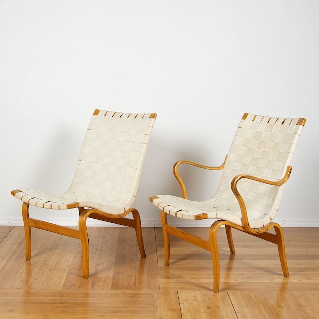 (2) bent plywood easy chairs by Bruno Mathsson: (2) bent plywood easy chairs by Bruno Mathsson: Mid 20th c., (1) armchair and (1) side chair, 32.5"w x 23.25"w x 24"d (armchair) - Condition Report: overall good/fair, general finish and wood distress