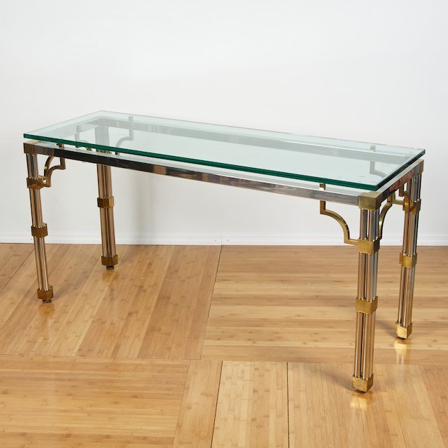 Designer chromed steel and brass console table: Designer chromed steel and brass console table: Circa 1970s, plate glass top, 30"h x 60"l x 20"d - Condition Report: overall good, some evidence of age and use, structurally sound