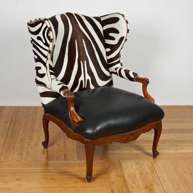 Louis XV style zebra and leather winged fauteuil: Louis XV style zebra and leather winged fauteuil: Late 20th c., Ralph Lauren style, 41"h x 29"w x 28"d - Condition Report: overall good, clean, structurally sound