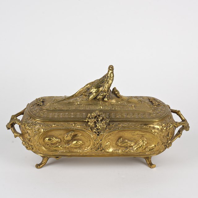 After Auguste Nicolas Cain (1821-1894, French), b: After Auguste Nicolas Cain (1821-1894, French), bronze: Late 19th c., gilt bronze box with bird finial, 7.5"h x 13.5"l x 5"d - Condition Report: overall good, hinge repair to hasp, gilding rubbed