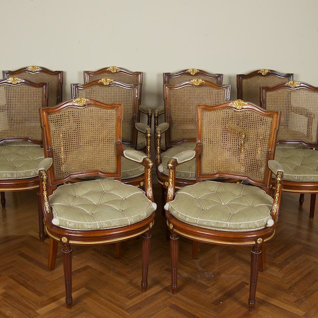 Set (10) Louis XVI style bronze mounted fauteuils: Set (10) Louis XVI style bronze mounted fauteuils: First half 20th c., caned seats and loose cushions, 38"h x 23"w x 20.5"d - Condition Report: overall good, light finish and wood distress commensurat