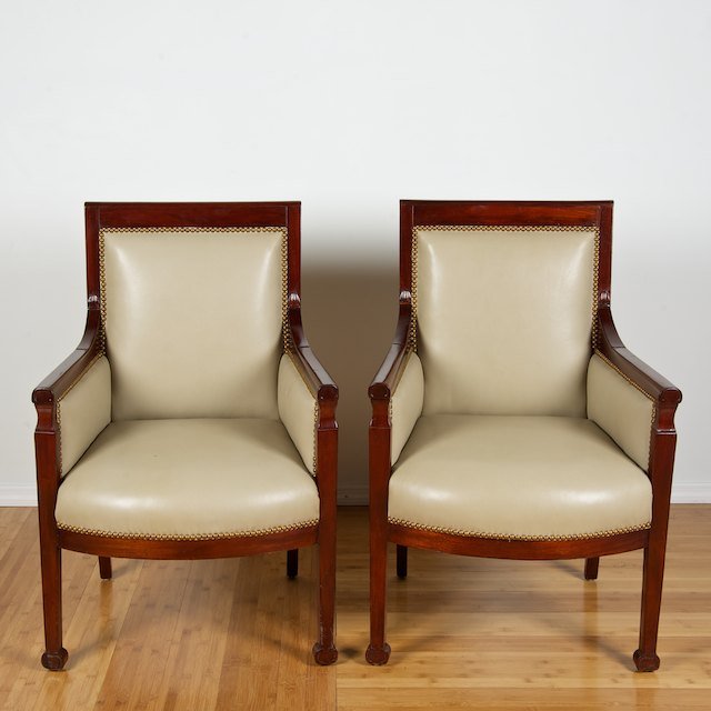 Pair Late Empire mahogany and leather bergeres: Pair Late Empire mahogany and leather bergeres: 19th c., close-nailed cream leather, 37"h x 25"w x 20"d - Condition Report: overall good, insect damage, restorations, structurally sound