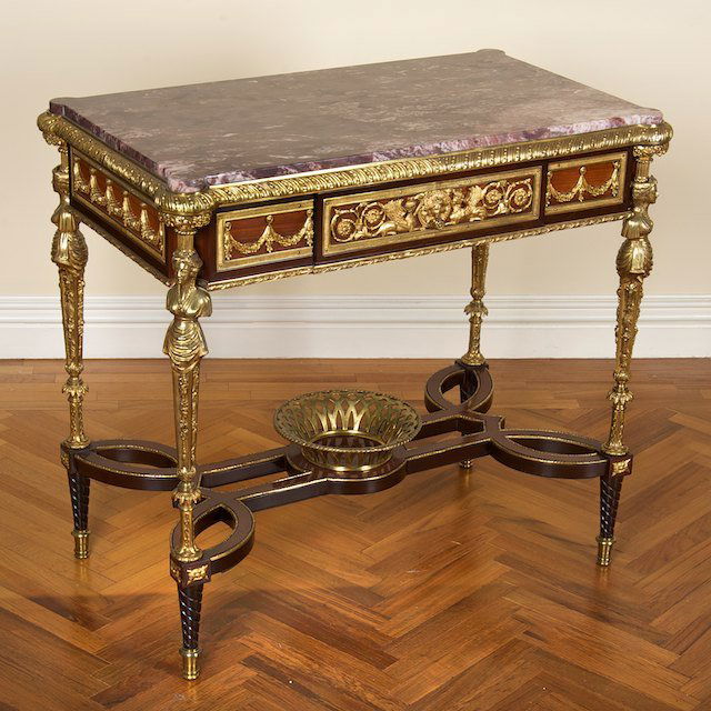 Louis XVI style ormolu mounted center table: Louis XVI style ormolu mounted center table: 20th c., in the manner of Adam Weisweiler, with marble top and looped stretcher, 30"h x 33.5"l x 19.5"d - Condition Report: overall good, general finish an